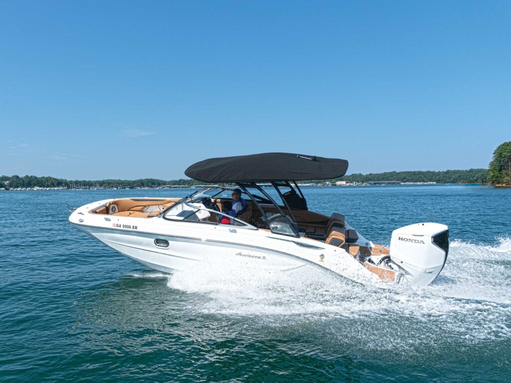 Hurricane SunDeck 2600 OB on the lake