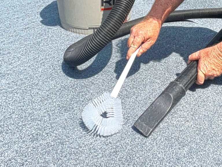 Using a vacuum to clean boat carpet