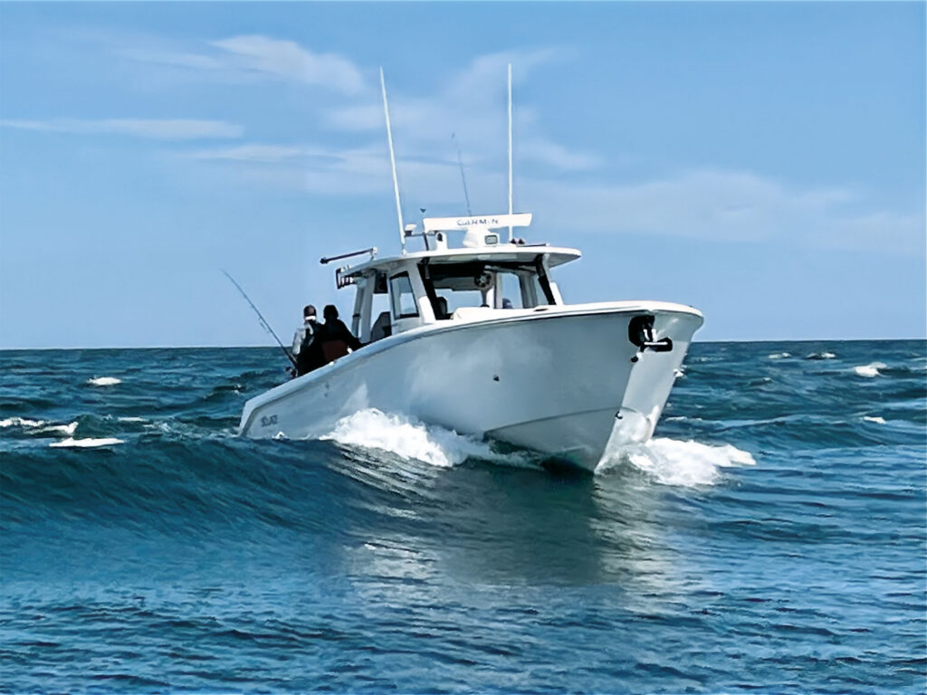 Boat riding over a wave