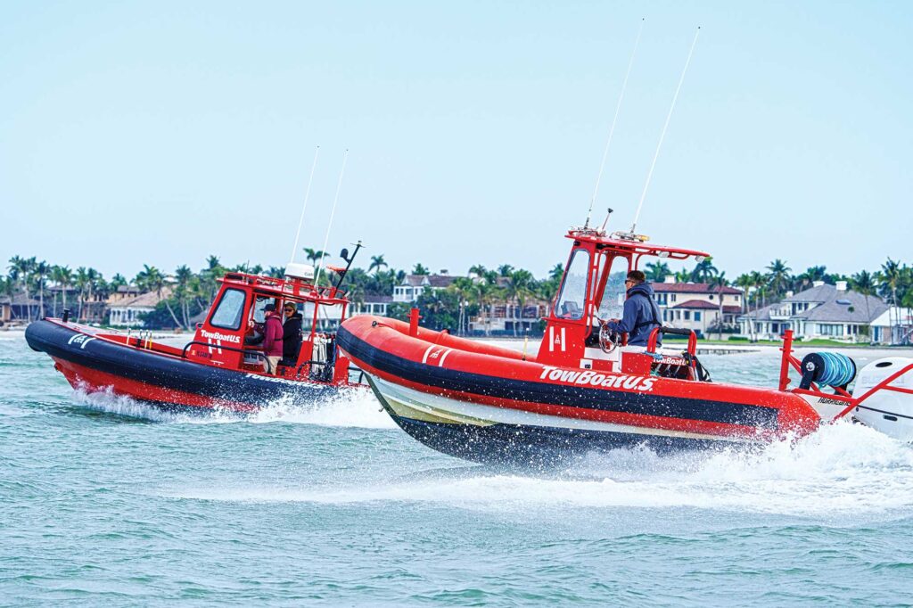 Two tow boats running on the water