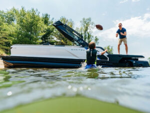 Kirk Cousins on a Manitou pontoon boat