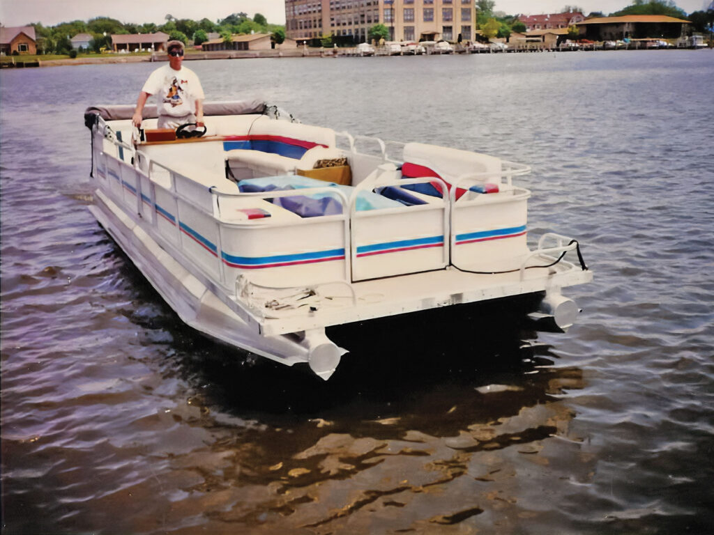 Malcolm Sohm aboard his original custom pontoon boat