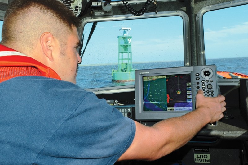 PORTSMOUTH, Va. – Petty Officer 3rd Class Evan Beavers checks a buoy’s placement against the electronic chart onboard a 25-foot Response Boat – Small from Coast Guard Station Portsmouth, on the Elizabeth River, Aug. 28, 2011. The small boat crew from Station Portsmouth gauged the operability of numerous aids to navigation in the greater Norfolk area after weathering the winds of Hurricane Irene. U.S. Coast Guard Petty Officer 3rd Class Stephen Lehmann.