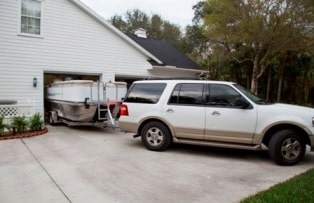 The pontoon boat models from Island Boats retract to a 7’4” beam for trailering and storage, and expand to ten feet wide once on the water.