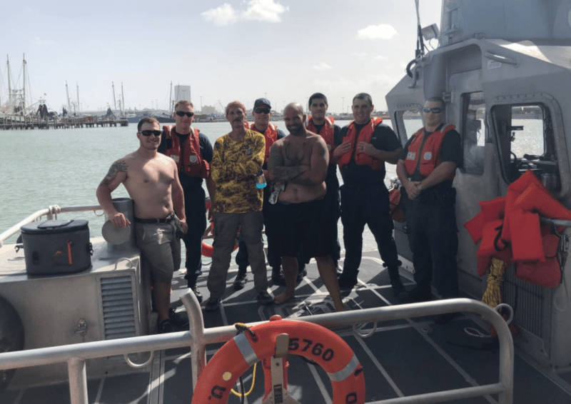 Rescued boaters are all smiles after being saved by US Coast Guard