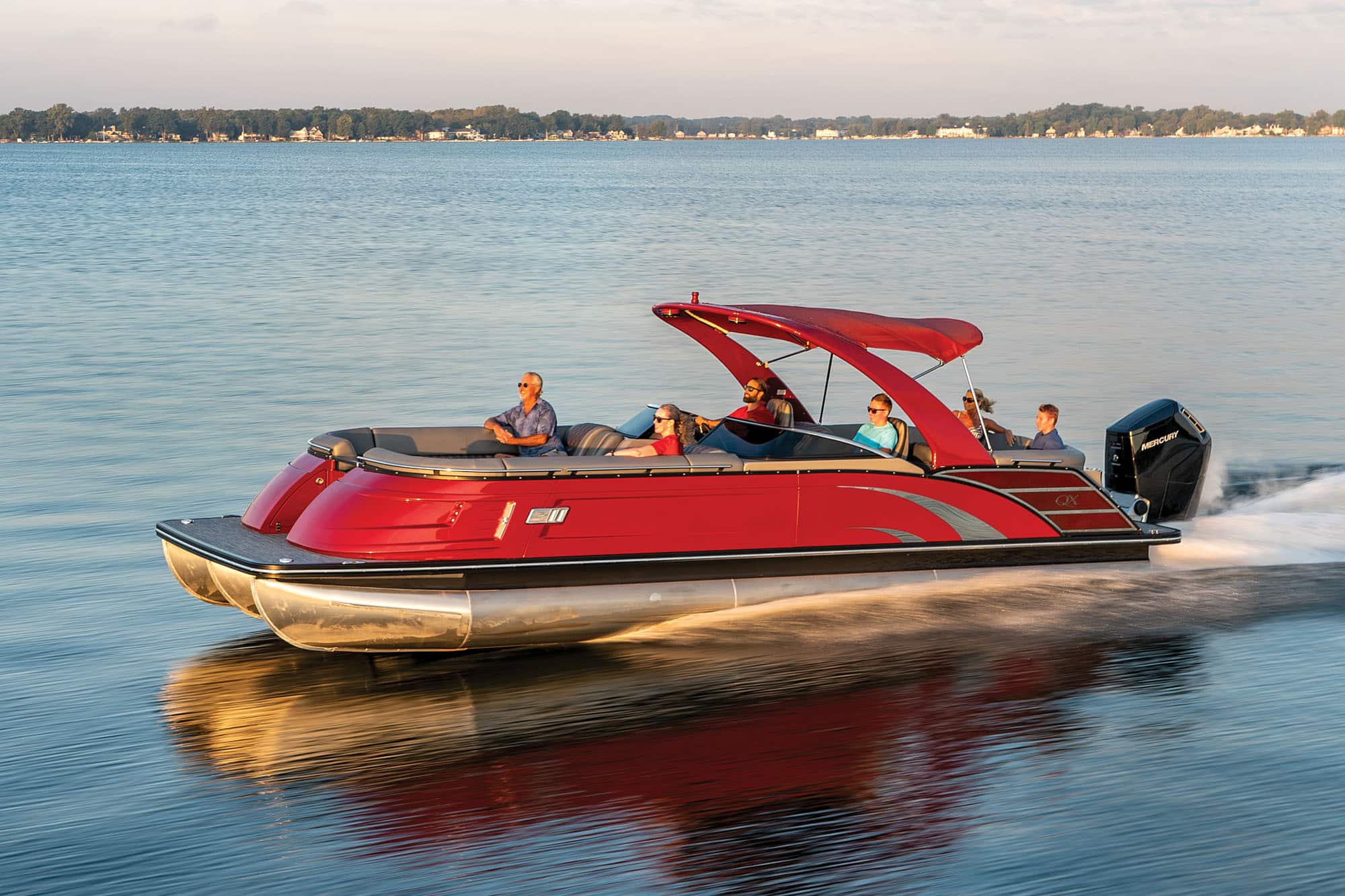 https://www.boatingmag.com/wp-content/uploads/2021/12/BTGBG22_PON_Bennington-QX28-Wide-Beam-Fastback_01.jpg