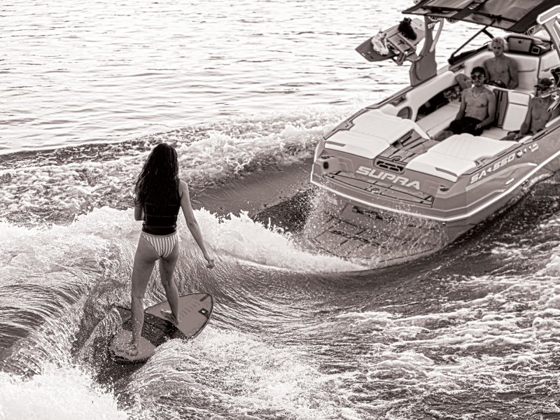 Wakesurfing behind inboard boat
