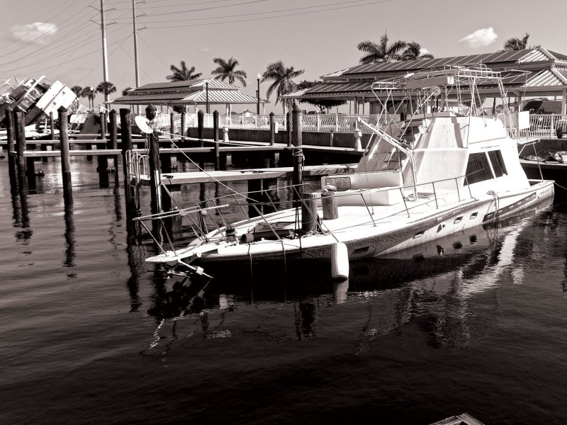 Damaged boat sunk in its slip