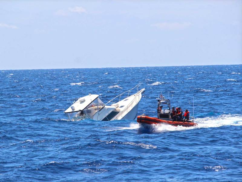 Boat sinking off the coast