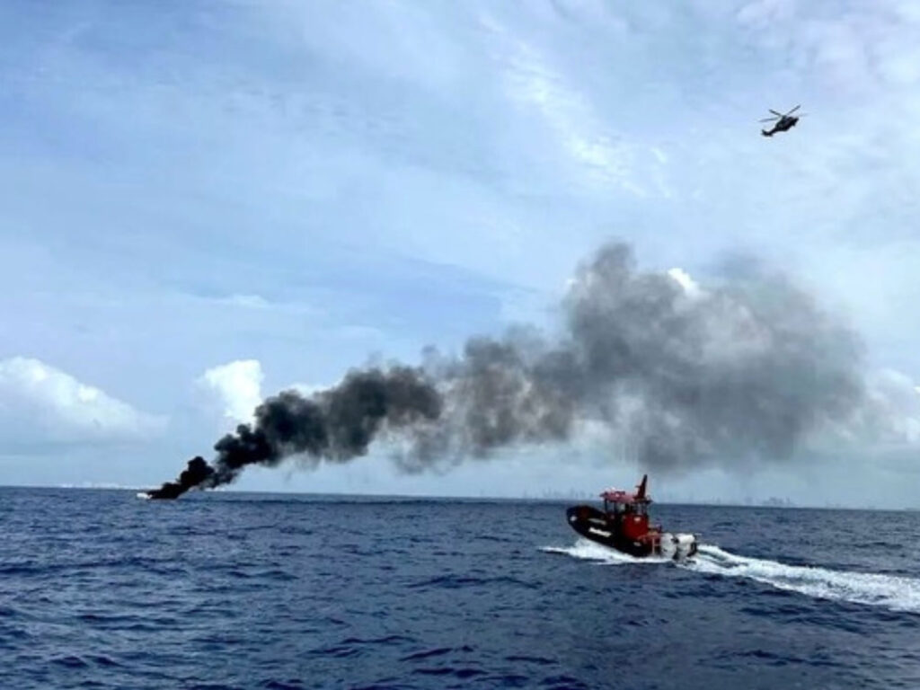 Coast Guard approaching a boat fire