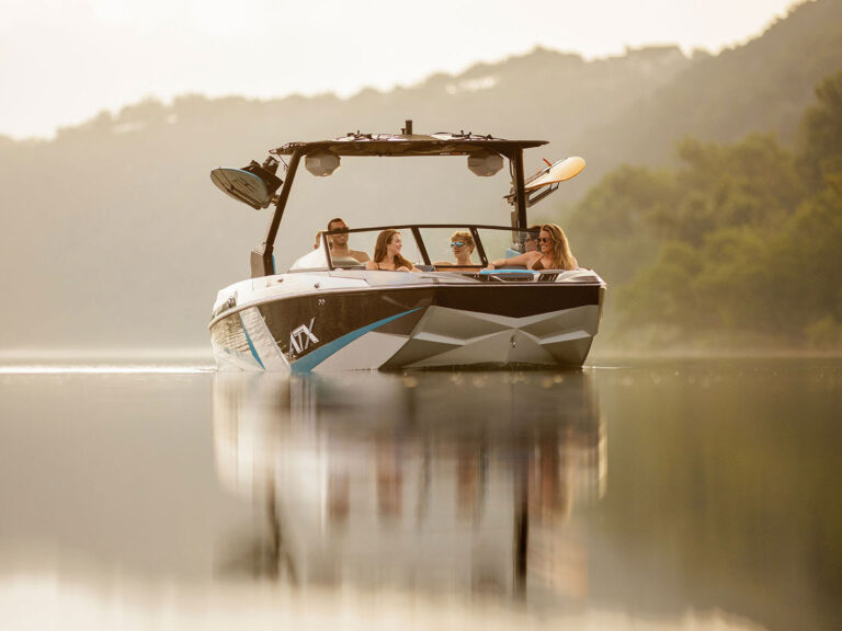ATX 22 Type-S Surf Boat on the lake