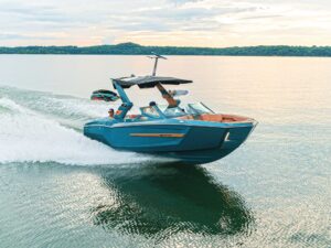 MasterCraft X24 on a glassy lake