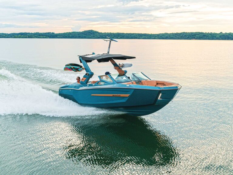 MasterCraft X24 on a glassy lake