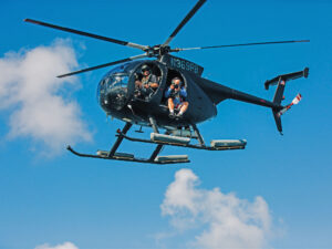 Paul Barth piloting a helicopter