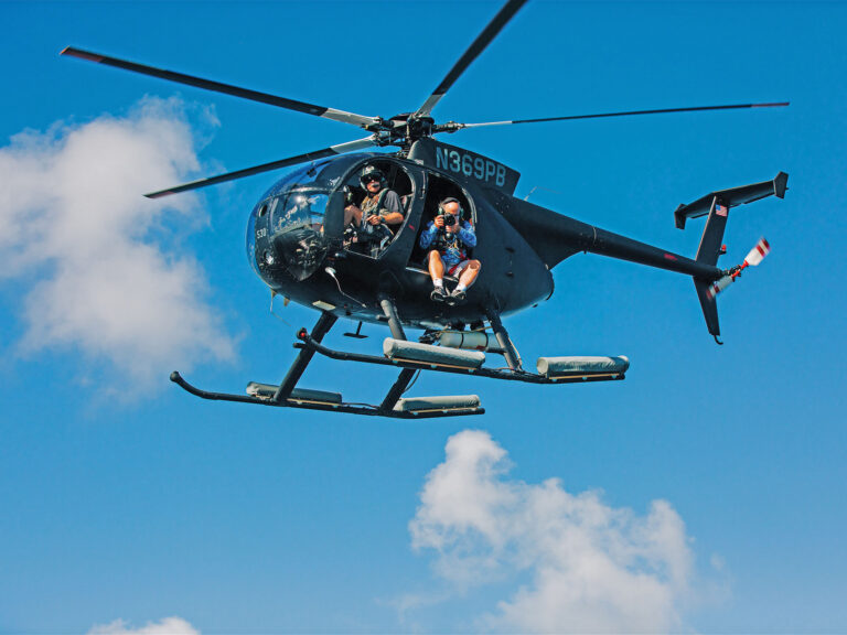 Paul Barth piloting a helicopter