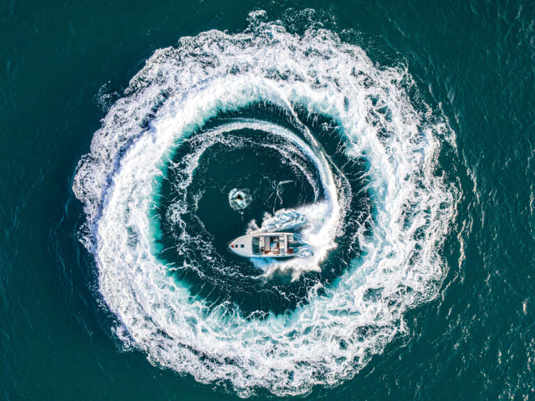 Boat circling a man overboard