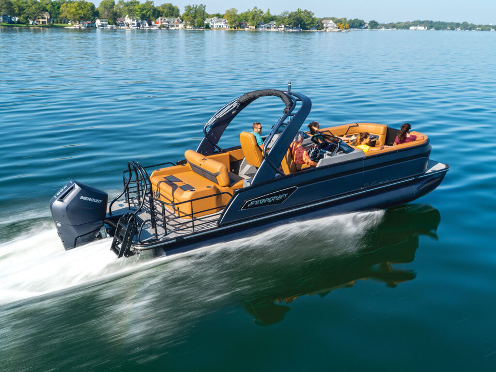 Starcraft SX 25 Q DC motoring on glassy water