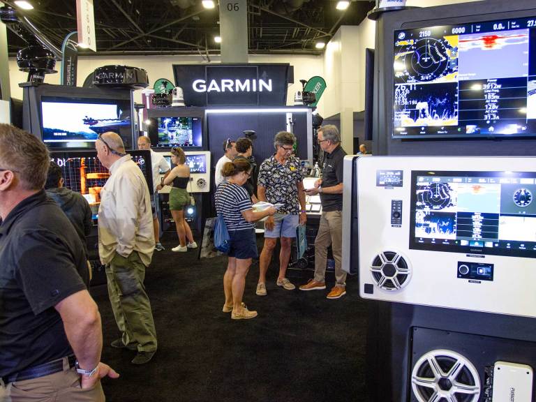 BTG226-MIBS-Miami-International-Boat-Show Crowds gather in the electronics area at MIBS