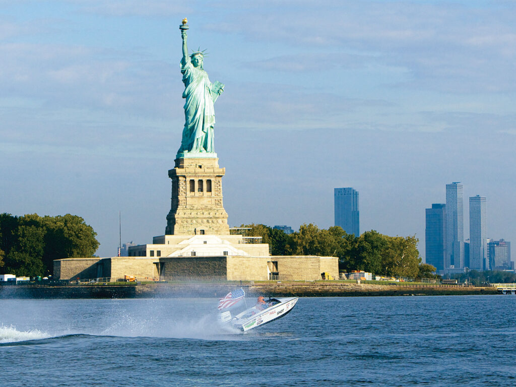 Tim Sharkey running his boat near the Statue of Liberty