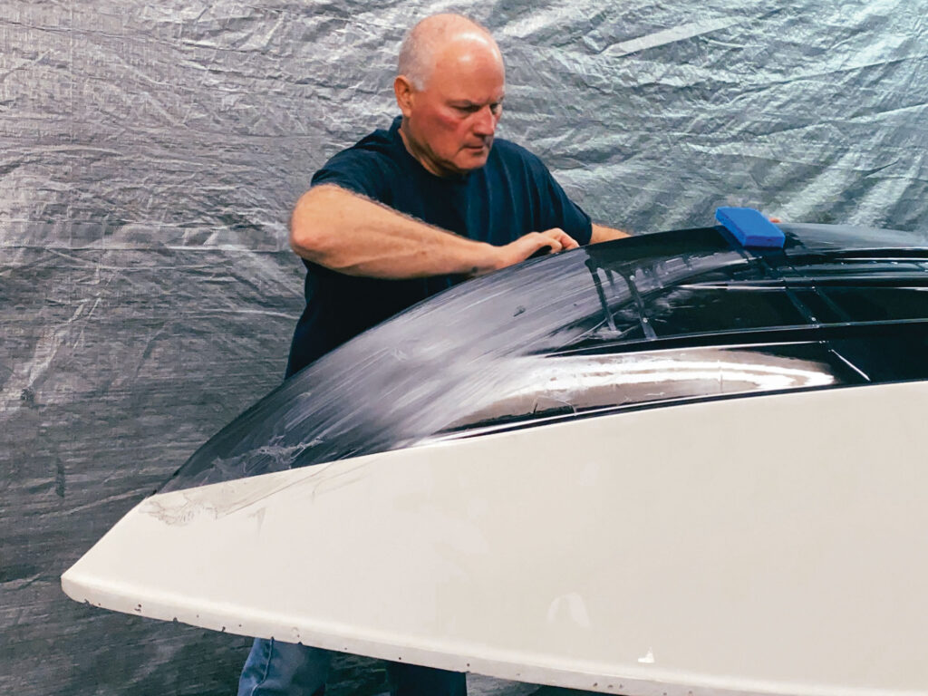 Tim Sharkey working on a boat