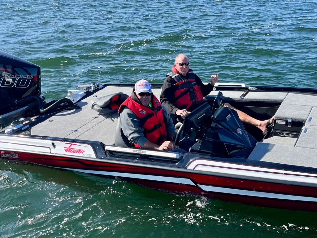 Bass boat drivers with life jackets on