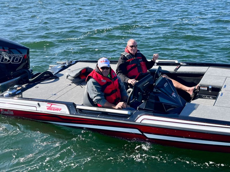 Bass boat drivers with life jackets on