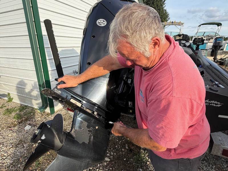 Boater removing a lower unit on an engine
